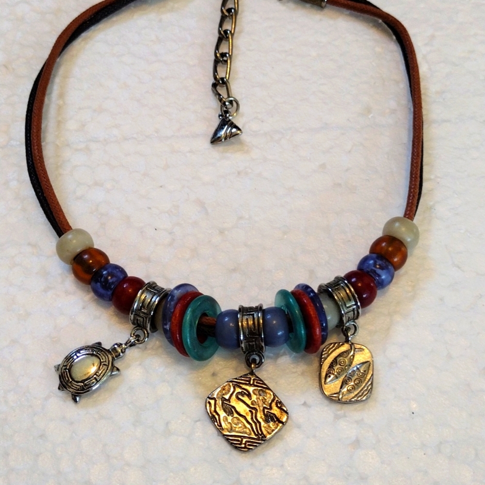 Handsome beads and charms choker necklace.